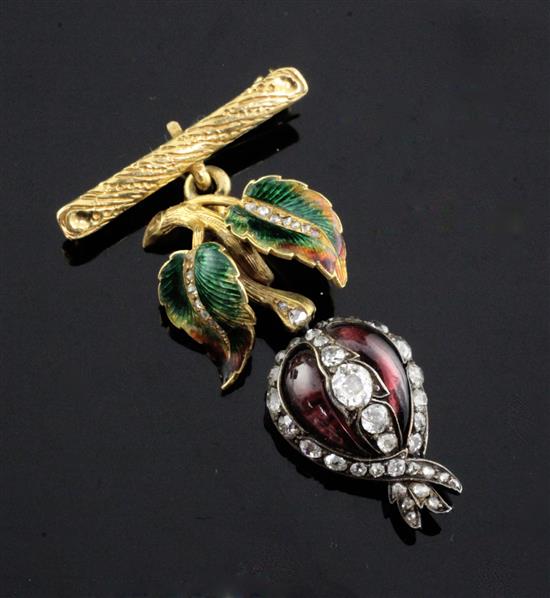 An early 19th century cabochon garnet and diamond pendant with hairwork back and later enamelled 18ct gold suspension.